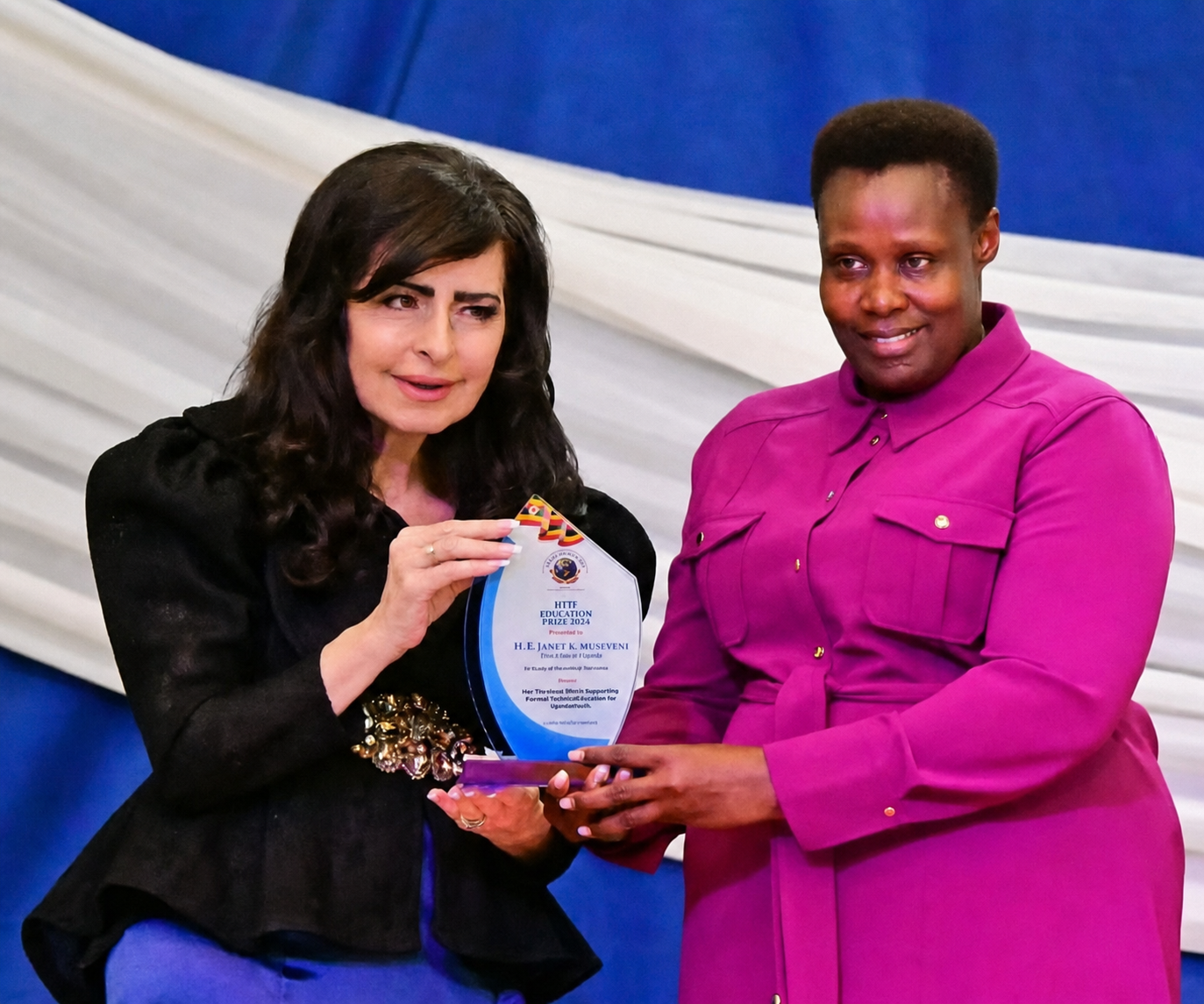 Dr. Michelle Corral receiving the Heal the Planet Humanitarian Award from Vice President Jessica Alupo of Uganda